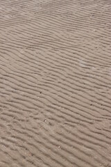 wind blown sand waves on beach