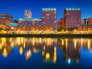 Fototapeta na wymiar Rotterdam, Netherlands. View of the city center. Cove and pier for boats and ships. Panoramic view. Cityscape in the evening. Skyscrapers and buildings.