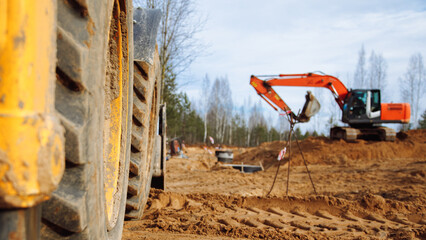 excavator on a construction site working on a pile of gravel. construction scene