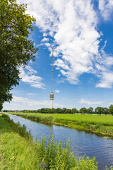 Obraz premium Landscape with Beilervaart and transmission tower Smilde in the backgroundThe Netherlands