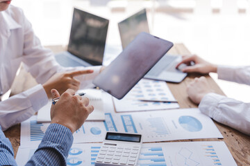 Young colleagues having great business conversations in a modern coworking office. Teamwork concept. Horizontal blurry background. Fireworks.