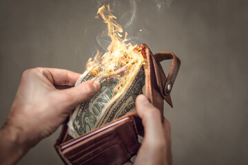 Burning US Dollar bills in a wallet
