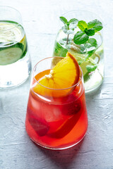 Summer cocktails. Cold drinks with fresh fruits and mint. Healthy mocktails. Glasses of lemonade...