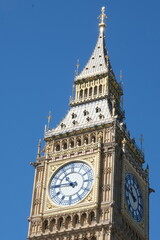 Big Ben clock tower close up in London on the blue sky. Symbol of London, United Kingdom.