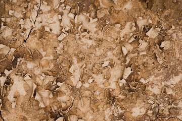 Brown rusty grunge background. Abstract texture of dry clay ground with cracks on earth soil