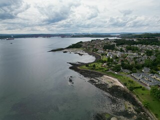 Aerial view of Dalgety bay coastal town surrounded by buildings and water