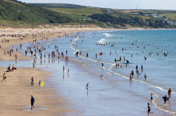 Elevated view of Tourists and holiday makers on the stunning Woolacombe Beach in North Devon UK
