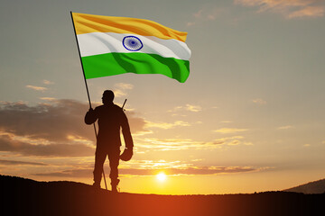 Silhouette of soldier with India flag on a background the sunset or the sunrise. Greeting card for Independence day, Republic Day. India celebration.