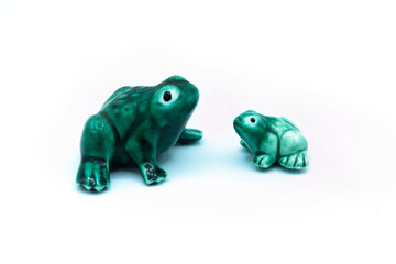 ceramic frogs isolated on white background, mother and baby
