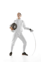 Young girl, fencer in white fencing costume posing with rapier isolated on white background. Sport,...