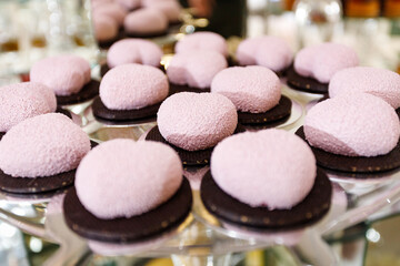 Fresh, appetizing, sweet, modern desserts close up on a decorated festive buffet table