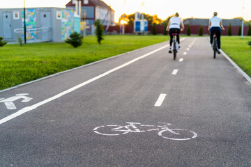 people in a blur on a bike path