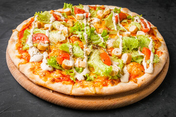 hot delicious traditional italian pizza on a dark stone background