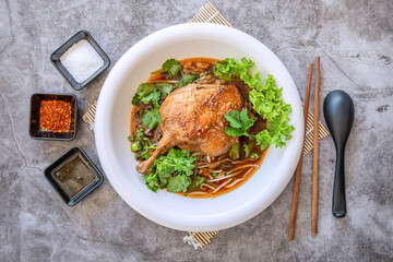 Stewed Duck Noodle Soup with seasoning From Top Angle View on Grey Table.