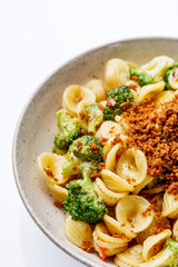 orequette pasta with broccoli on a white background