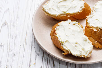 baguette cream cheese sandwich on a white background