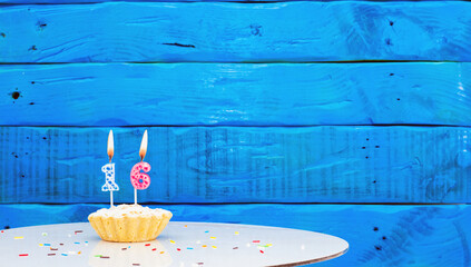 Festive background with a cake on the background of blue boards, copy space, a beautiful background...