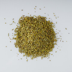 fragrant dried rosemary on a white acrylic background