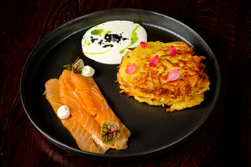 potato pancakes with salmon and sauce