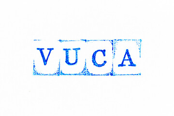 Blue color ink rubber stamp in word VUCA (abbreviation of Volatility, uncertainty, complexity and...