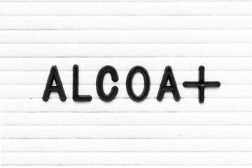 Black color letter in word ALCOA+ on white felt board background