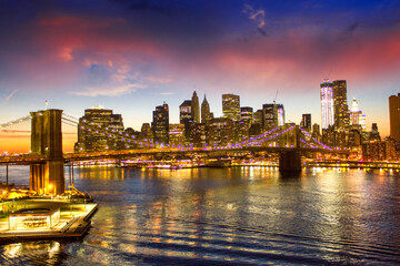 Fototapeta na wymiar Brooklyn Bridge and Manhattan at sunset on East River, New York