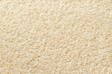 close-up texture of raw long rice basmati top view.