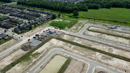Aerial construction of standalone homes foundations in new subdivision