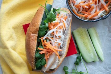 Traditional pork sandwich with pickled daikon, carrots, sliced cucumbers and cilantro