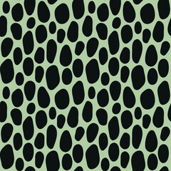 Modern seamless pattern with black spots on green background.  Exotic art design for paper, fabric, cover, interior decor. Vector illustration.