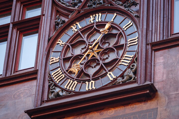 Fototapeta na wymiar Clock on the wall, Medieval Basel Town Hall (Rathaus), Switzerland