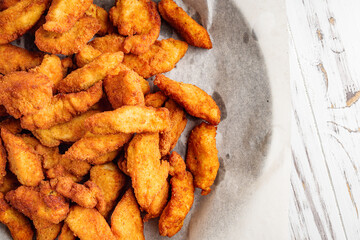 chicken nuggets on a white wooden rustic background