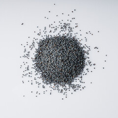 poppy seeds on a white acrylic background