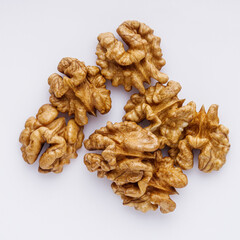 dried walnuts on a white acrylic background