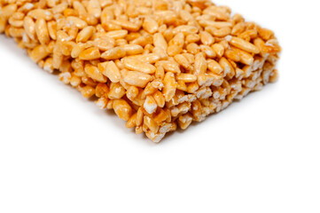 Sweetness from grains of puffed rice, shot close-up on a white background.