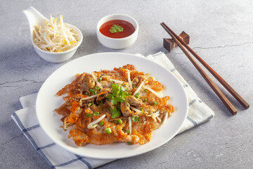 Crispy fried mussels omelette served with bean sprout and spicy sauce.