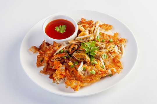 Crispy fried mussels omelette served with bean sprout and spicy sauce.