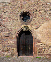 Fototapeta na wymiar Entrance to the Ruprechtsbau with the famous angel coat of arms. Baden Wuerttemberg, Germany, Europe