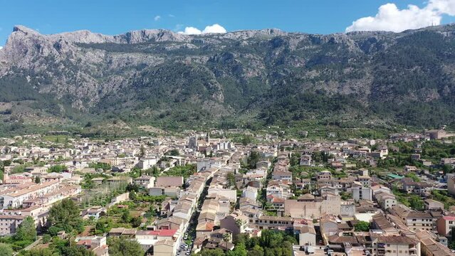 Helicopter view of the old town of S&oacute;ller, with the Church of St. Bartholomew, Roman Catholic parish church, S&oacute;ller, mountains behind, Serra de Tramuntana, Mallorca, Balearic Islands, Spain