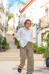 Young man walks through the Santa Cruz neighborhood in Alicante, Spain.