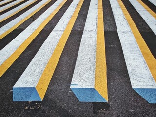Closeup shot of a 3D painted zebra crossings on asphalt