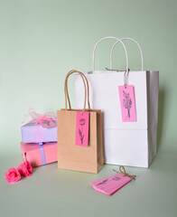 beautiful shopping gift bags decorated with pink tags with flower