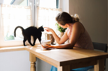 Woman petting her cat