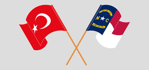 Crossed and waving flags of Turkiye and The State of North Carolina