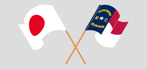 Crossed and waving flags of Japan and The State of North Carolina