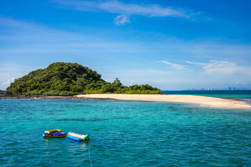 Beautiful sky, and island, sea landscape tree, The view with banana boat player On the day of sailing.