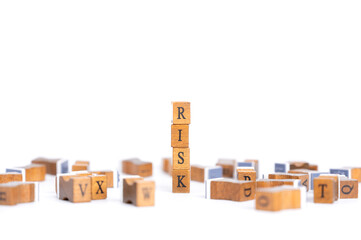 Stamp wooden cube block of risk wording for risk. Business and Financial concepts.
