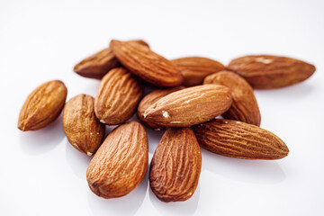 fresh almonds in shell on a white background