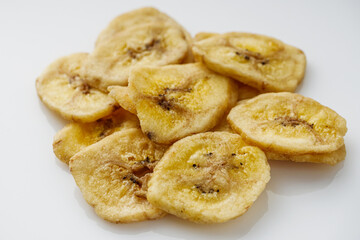 delicious dried banana on a white acrylic background