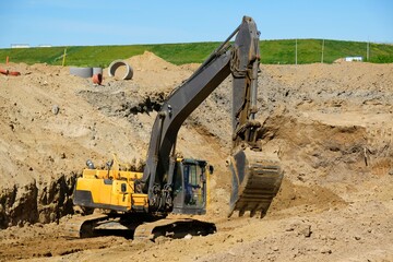 Obraz premium Working excavator at construction site